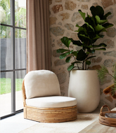 Pablo Rattan Armchair styled in a natural modern interior setting